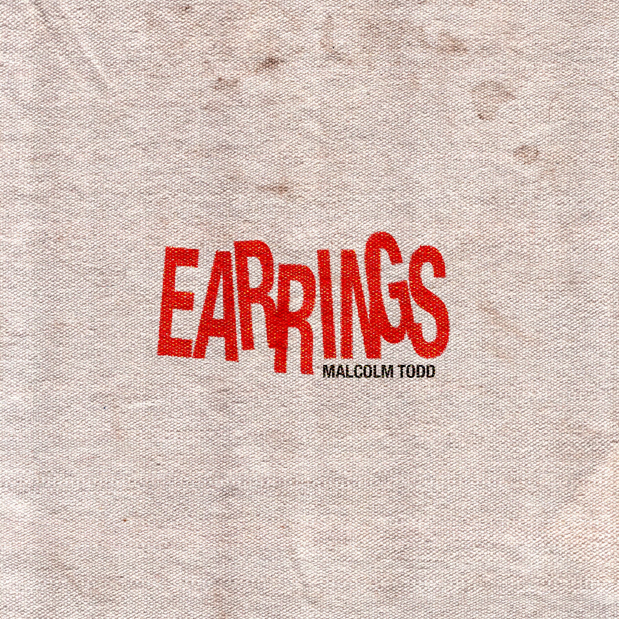 Earrings cover: the title in warped red type pressed into beige canvas fabric, with Malcolm Todd set small beneath